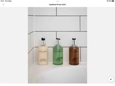a bathroom with three bottles ofodorizers on a counter at Spacious flat St Ives former farmhouse, parking in St Ives