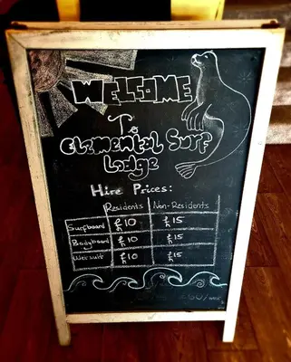 a chalkboard menu for a restaurant with a turkey on it at Elemental Surf Lodge in Newquay