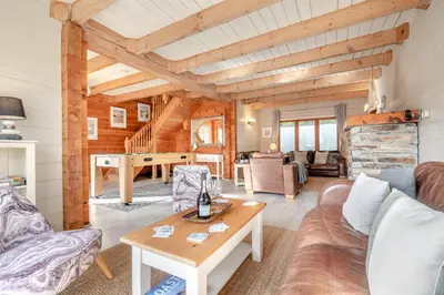 a living room with a couch and a table at 3 Bed in Wadebridge oc-p00104 in Little Petherick