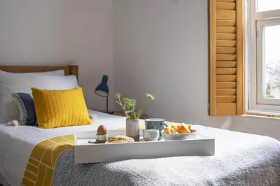 a tray of food on top of a bed at 3 Bed in Porthleven oc-12bayv in Porthleven