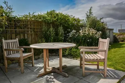 two chairs and a table and a table and two chairs at 1 Bed in Rinsey oc-1chapl in Praa Sands