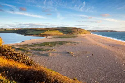 a view of a sandy beach with the ocean at 2 Bed in Porthleven oc-1mont in Porthleven