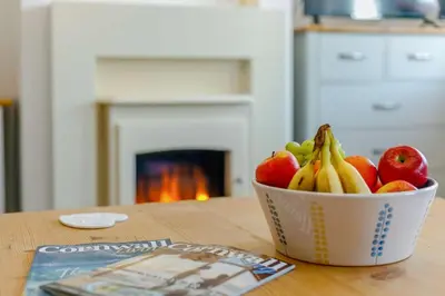 a bowl of fruit sitting on top of a table at 3 Bed in Porthleven oc-1seav in Porthleven