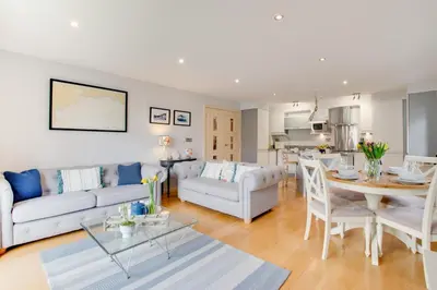 a living room with a couch and a table at 2 Bed in Looe oc-6creek in Looe
