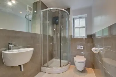 a bathroom with a shower and a toilet and a sink at 2 Bed in Looe oc-6creek in Looe