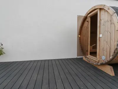 a wooden door in the corner of a room at 5 Longshore in Newquay