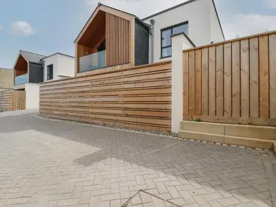 a wooden fence in front of a house at 5 Longshore in Newquay
