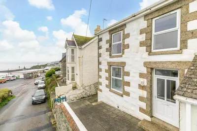 an aerial view of a house with a parking lot at 3 Bed in Porthleven oc-atlant in Porthleven