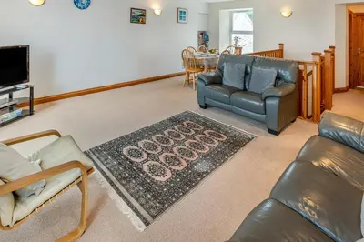 a living room with a couch and a table at 3 Bed in Porthleven oc-atlant in Porthleven