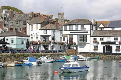 a group of boats in the water in a town at 3 Bed in Falmouth oc-anchge in Falmouth