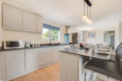 a kitchen with white cabinets and a counter top at 3 Bed in Higher Crackington oc-avond in Crackington Haven