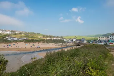 a group of people on a beach near the water at 3 Bed in Penrose oc-butcup in Saint Ervan