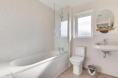 a bathroom with a tub and a toilet and a sink at 2 Bed in St. Eval oc-boaths in Saint Ervan
