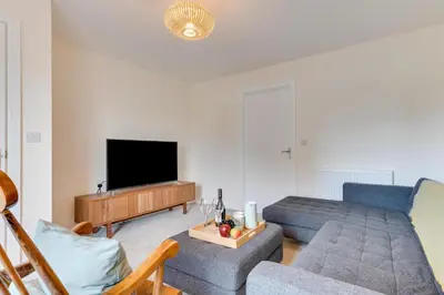 a living room with a couch and a tv at 2 Bed in St. Eval oc-boaths in Saint Ervan