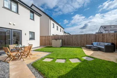 a garden with a patio and grass at 2 Bed in St. Eval oc-boaths in Saint Ervan