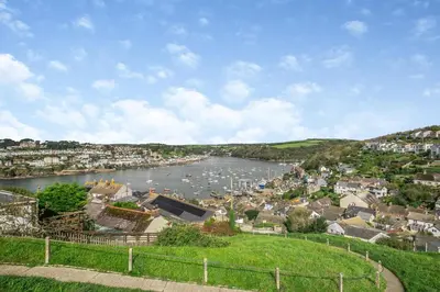 a view of a river with boats in a town at 2 Bed in Polruan oc-cgart2 in Fowey