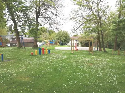 a park with a playground and a play area at Cornwall family friendly villa with free use of Pool, soft play, mini golf, tennis, gym, fitness classes, sauna and ice baths in Newquay