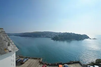 a view of a large body of water with boats in it at 1 Bed in Fowey oc-cmoonr in Fowey