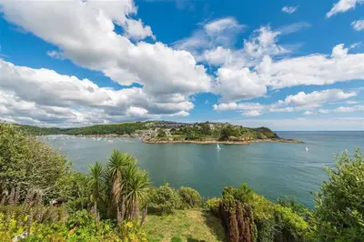 a view of a body of water with boats in it at 1 Bed in Fowey oc-cmoonr in Fowey