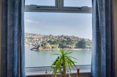 a window with a view of a body of water at 1 Bed in Fowey oc-cmoonr in Fowey