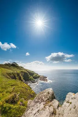 a view of the ocean with the sun in the sky at 4 Bed in Fowey oc-cridg2 in Fowey