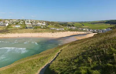 an aerial view of a beach with people on it at 4 Bed in Mawgan Porth oc-d26830 in Mawgan Porth