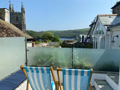 two chairs sitting on the roof of a house at 2 Bed in Fowey oc-forty in Fowey