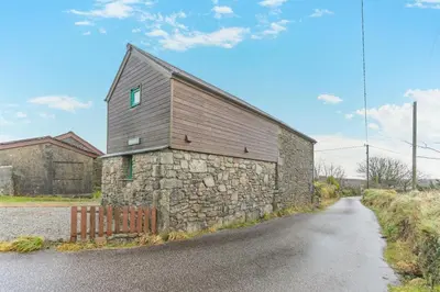 a stone building on the side of a road at 2 Bed in Redruth oc-gbells in Porkellis