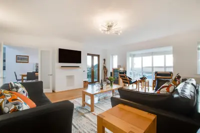 a living room with two couches and a tv at 4 Bed in Marazion oc-gwynsa in Marazion