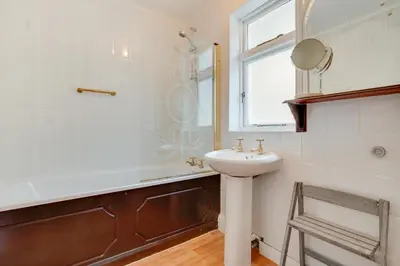 a bathroom with a sink and a shower and a mirror at 2 Bed in Helford oc-hcview in Helford