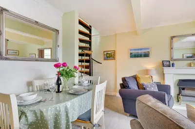 a living room with a table and a couch at 2 Bed in Helford oc-hcview in Helford