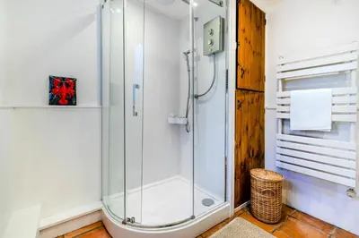 a shower in a bathroom with a glass shower stall at 3 Bed in Helford oc-hcwedn in Helford