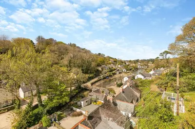 an aerial view of a village with houses and trees at 3 Bed in Helford oc-hcwedn in Helford