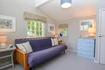 a living room with a purple couch in a room at 3 Bed in Helford oc-hcwell in Helford