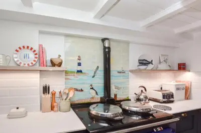 a kitchen with a stove top oven in a kitchen at 3 Bed in Helford oc-hcwell in Helford