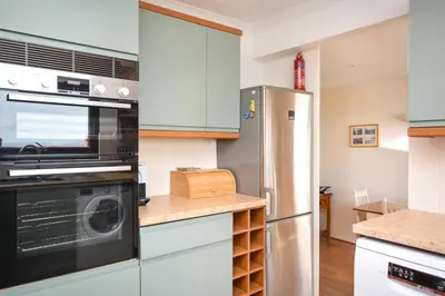 a kitchen with a stove and a refrigerator at 3 Bed in Porthleven oc-ingnoo in Porthleven