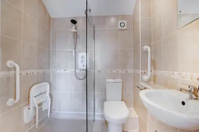 a bathroom with a shower and a toilet and a sink at 3 Bed in Porthleven oc-ingnoo in Porthleven
