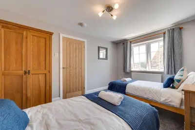 a bedroom with two beds and a window at 2 Bed in Fowey oc-jackda in Fowey