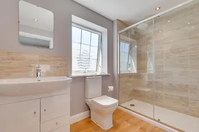 a bathroom with a toilet and a sink and a shower at 2 Bed in Fowey oc-jackda in Fowey