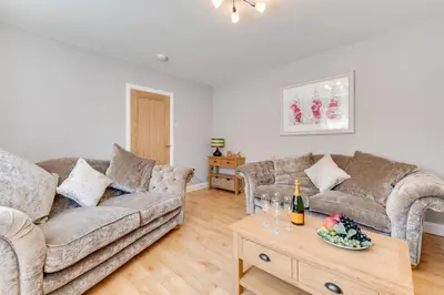 a living room with two couches and a table at 2 Bed in Fowey oc-jackda in Fowey