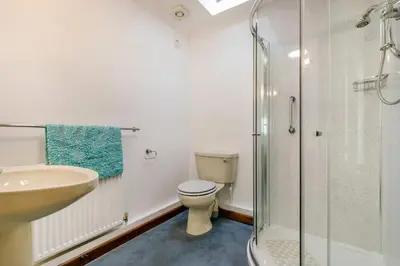 a bathroom with a toilet and a sink and a shower at 2 Bed in Looe oc-l00055 in Trelaske