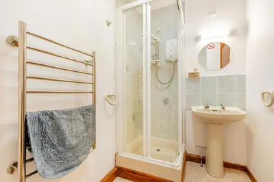 a bathroom with a shower and a sink at 1 Bed in Looe oc-l00063 in Trelaske