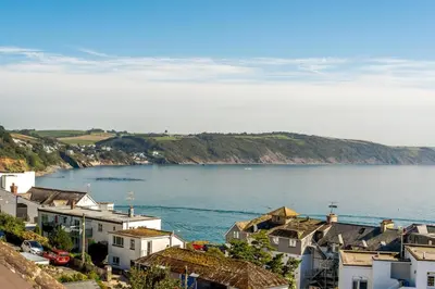 an aerial view of a town and a body of water at 1 Bed in Looe oc-l30006 in Looe