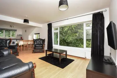a living room with a couch and a table at 2 Bed in Looe oc-l30020 in Looe