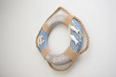 a wreath made out of a ring with the words cotonota croc at 2 Bed in Looe oc-l30020 in Looe
