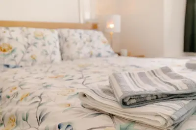 a bed with two towels sitting on top of it at 1 Bed in Looe oc-l30038 in Looe