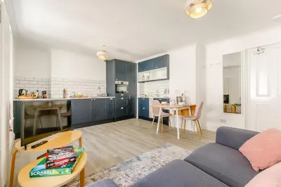 a living room with a couch and a table at 1 Bed in Looe oc-l30038 in Looe