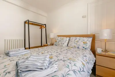 a bedroom with a bed with towels on it at 1 Bed in Looe oc-l30038 in Looe