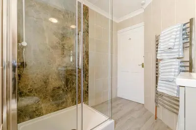 a bathroom with a shower and a sink at 1 Bed in Looe oc-l30038 in Looe