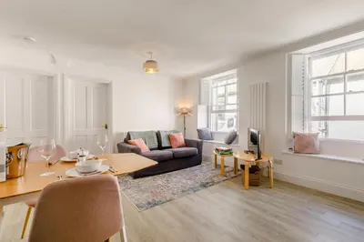 a living room with a couch and a table at 1 Bed in Looe oc-l30038 in Looe